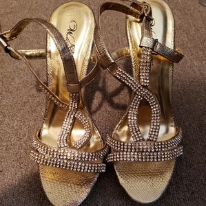 Beautiful gold open toe heels.